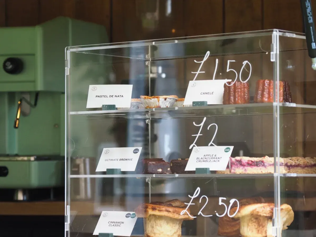 Bakes on a display stand in the horsebox serving hatch, with the sage Astoria machine behind